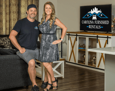Founders Amanda and Alex in a furnished Carolina Furnished Rentals living room