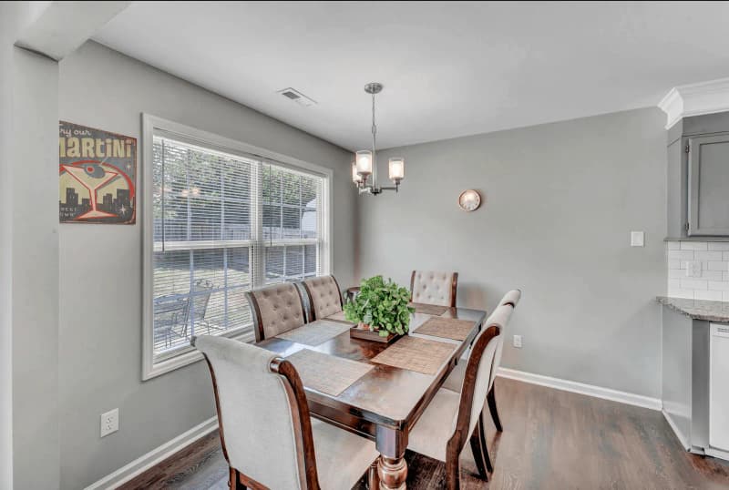 A furnished dining area beside a residential kitchen